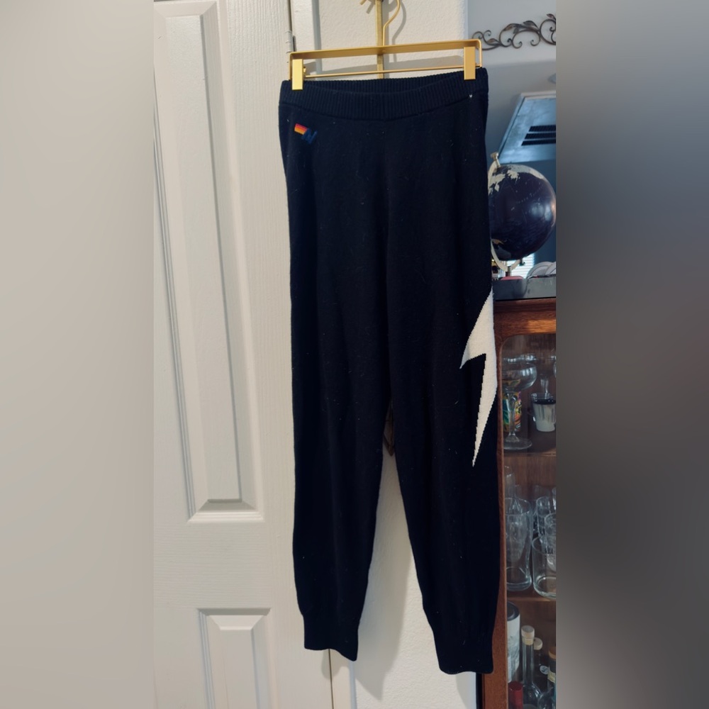 Black Pants with White Lightning Bolt Design